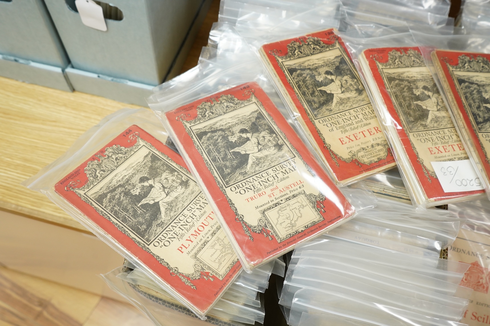 A collection of Ordnance Survey maps including Explorer series 1:25,000, Seventh Series One Inch, together with miscellaneous touring and historic editions (3 boxes)